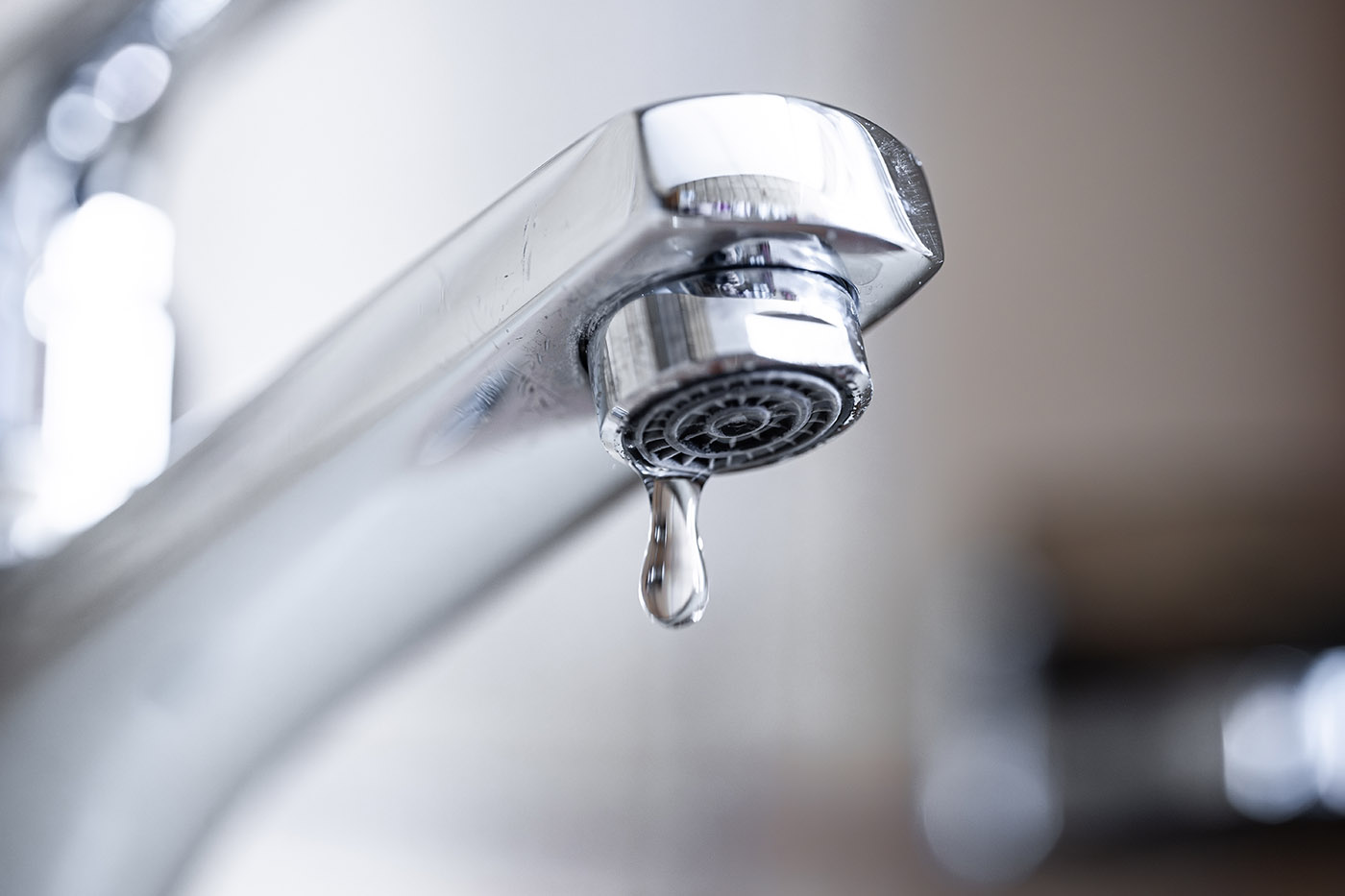 Faucet that is dripping water, contact us for a New York emergency well pump service.
