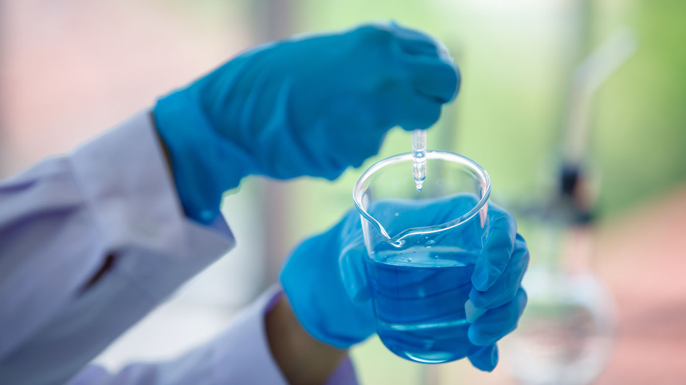 A scientist testing water quality, choose us for your New York / Pennsylvania  water treatment systems.
