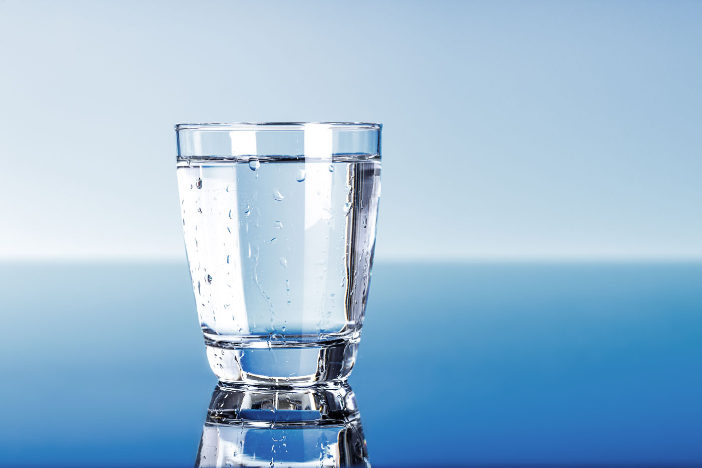 A freshly tested glass of water for a business, Amber Water Pros New York / Pennsylvania  commercial water softener company.